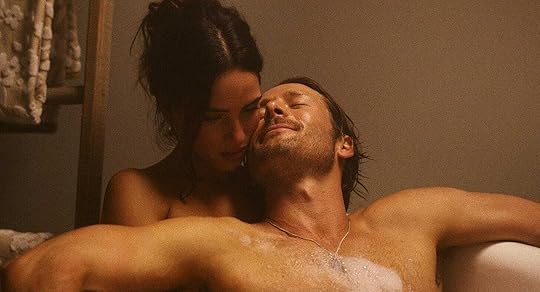 Glen Powell and Adria Arjona in the bath in