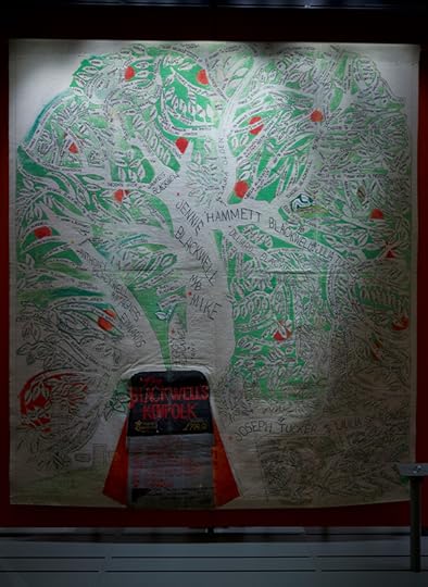 A nine foot tall by six foot wide canvas folk-art style rendition of a family tree.