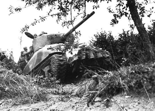 US tank, modified with iron teeth, cuts through the bocage (hedgerows) in Normandy, France, July 1944 (US Army Center of Military History)