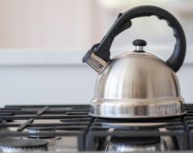 Photo of a kettle on a gas ring by Bongo via Morguefile