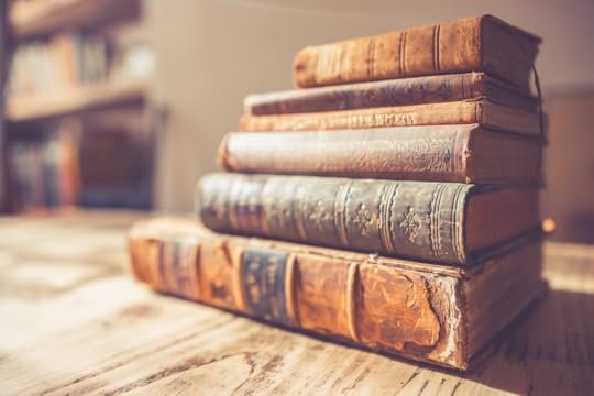 a stack of anique books