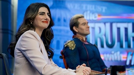 image of Victoria Neuman and Homelander at a news desk in the boys biggest questions