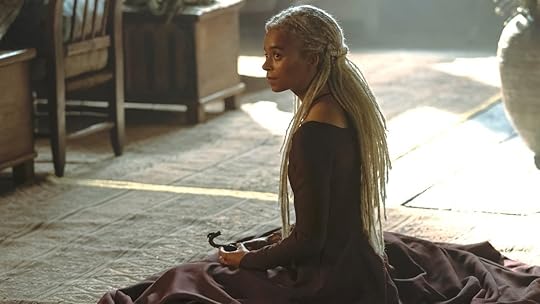 Rhaena sitting on the floor in her long dress on House of the Dragon