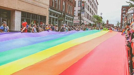 An image of the PRIDE flag at an annual pride parade.
