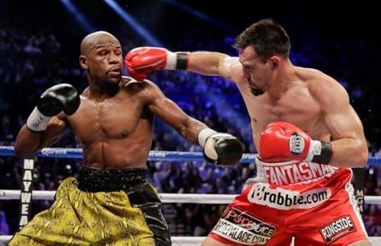 Robert Guerrero, right, throws a jab against Floyd Mayweather Jr. in the third round during a WBC welterweight title fight, Saturday, May 4, 2013, in Las Vegas. (AP Photo/Isaac Brekken)