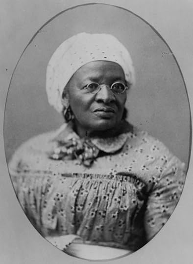 From 1900, African American woman, head-and-shoulders portrait, facing slightly right