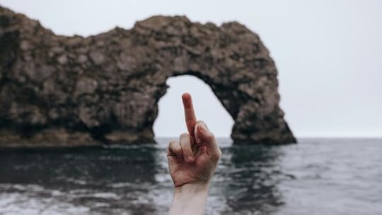 A person giving a middle finger to a rocky arch. Do you control your anger or does it control you?