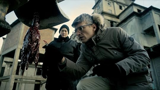A scientist looks at weird meat on an oil drill in Hell Hole.