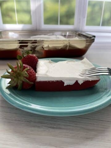 sugar free red gelatin on plate with whipped topping