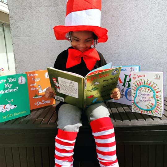 A child in a library reading