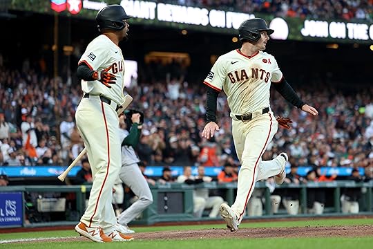 San Francisco Giants’ Mike Yastrzemski (5) scores on a sacrifice...