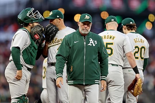 Oakland Athletics manager Mark Kotsay heads back to the dugout...