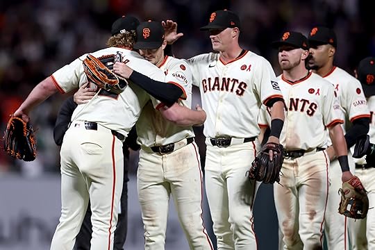 San Francisco Giants starting pitcher Logan Webb (62) and teammates...
