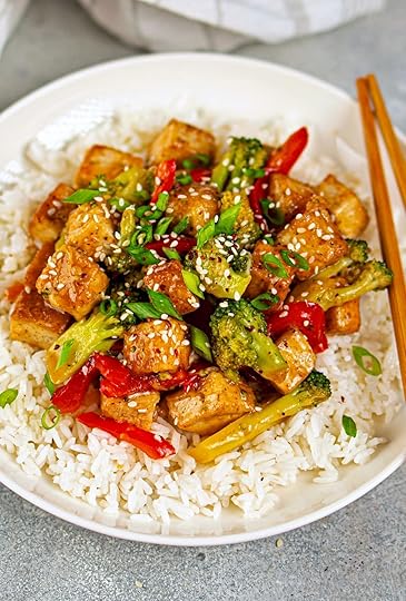 tofu stir-fry with vegetables over rice in bowl