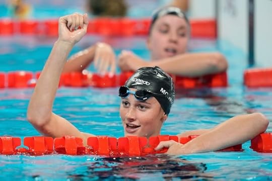 Summer McIntosh, of Canada, celebrates winning the the women's 200-meter butterfly final at the 2024 Summer Olympics in Nanterre, France, Thursday, Aug. 1, 2024. (AP Photo/Martin Meissner)