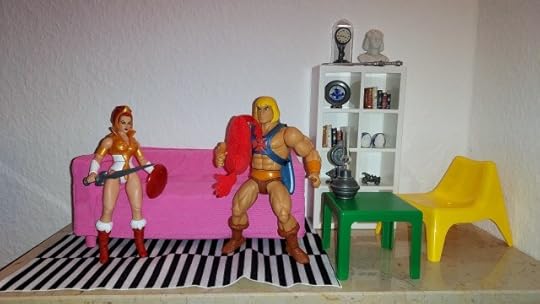 He-Man holds a pillow, while Teela looks on.