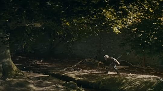 An older knight practices with his sword near a tree in the woods on A Knight of the Seven Kingdoms
