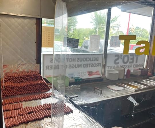 Photo of hot dogs on a grill