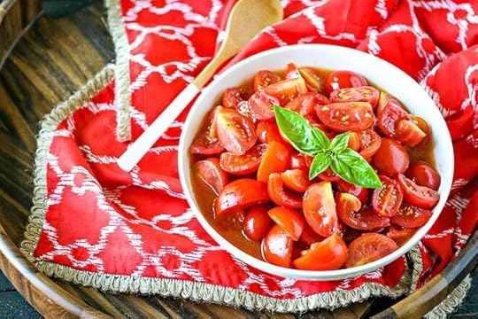 bowl of tomato salad made with jersey tomatoes with basil on top