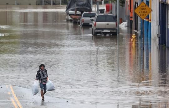 A Pajaro resident salvages belongings from his flooded home on Saturday, March 11, 2023. (Shmuel Thaler -- Santa Cruz Sentinel file)