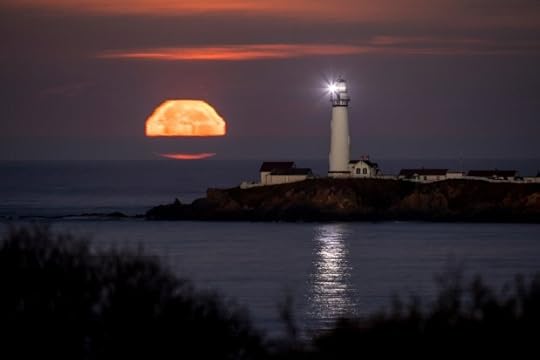 Pigeon Point Lighthouse shines its light as a full moon sets off the San Mateo coast, Sunday, Nov. 29, 2020.The 115-foot-tall brick structure south of Half Moon Bay has finally been awarded full funding to complete an $18.9 million restoration. (Karl Mondon/Bay Area News Group)