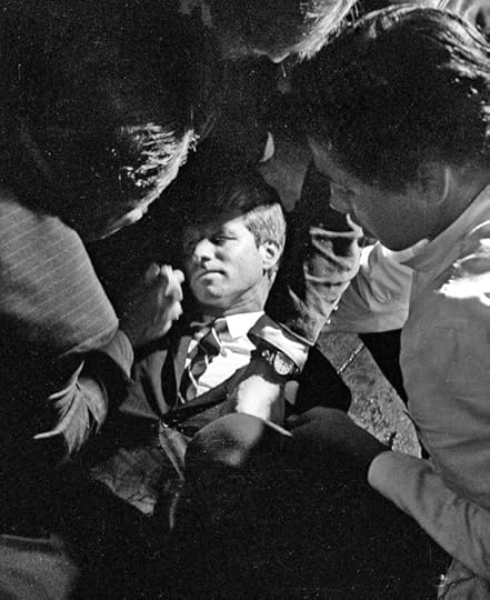 FILE - In this June 5, 1968 file photo, Hotel busboy Juan Romero, right, comes to the aid of Senator Robert F. Kennedy, as he lies on the floor of the Ambassador hotel in Los Angeles moments after he was shot. Romero was a teenage busboy in June 1968 when Kennedy walked through the Ambassador Hotel kitchen after his victory in the California presidential primary and an assassin shot him in the head. He held the mortally wounded Kennedy as he lay on the ground, struggling to keep the senator's bleeding head from hitting the floor. (Richard Drew/Pasadena Star News via AP, File)