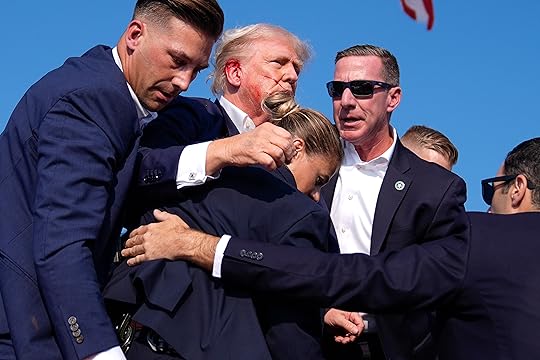 Republican presidential candidate former President Donald Trump is surrounded by...