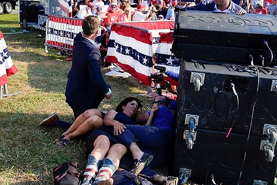 People take cover as U.S. Secret Service agents surround Republican...