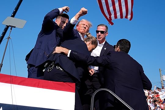 Republican presidential candidate former President Donald Trump is surrounded by...