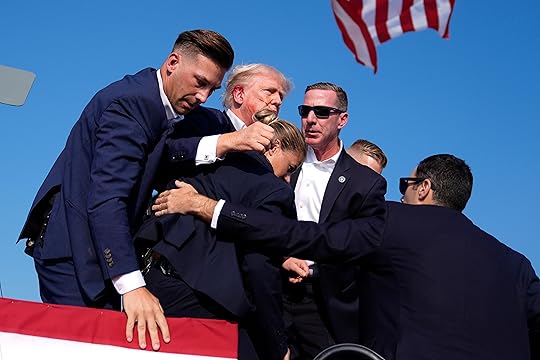 Republican presidential candidate former President Donald Trump is surrounded by...