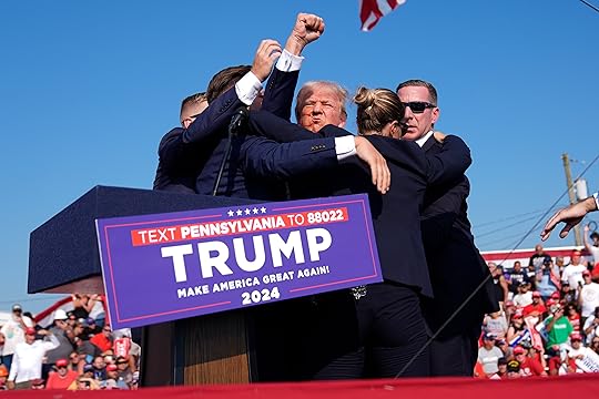 Republican presidential candidate former President Donald Trump is surrounded by...