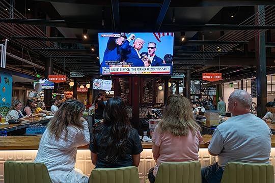 MILWAUKEE, WISCONSIN – JULY 13: People watch television news at...