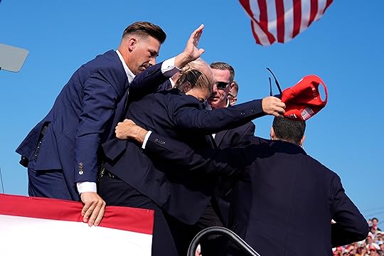 Republican presidential candidate former President Donald Trump is surrounded by...