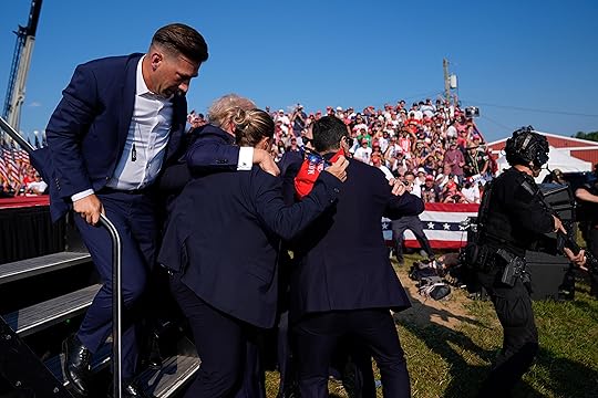 Republican presidential candidate former President Donald Trump is surrounded by...
