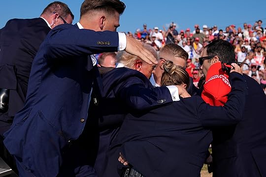 Republican presidential candidate former President Donald Trump is surrounded by...