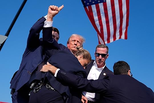 Republican presidential candidate former President Donald Trump is surrounded by...
