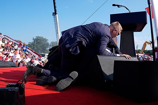 Republican presidential candidate former President Donald Trump is covered by...