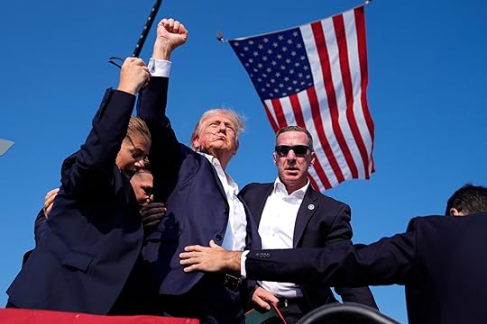 Republican presidential candidate former President Donald Trump is surrounded by...