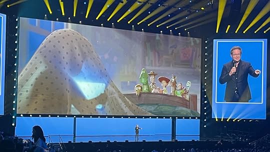 Andrew Stanton shows off an image from the upcoming Toy Story 5 at D23 Expo 2024.