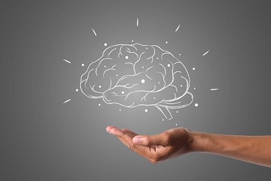 Sketch in white of a brain on a grey background, hovering over an open hand.