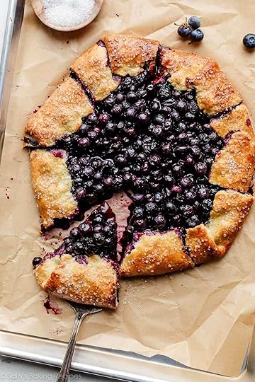 blueberry galette with slice being removed.