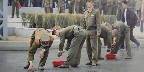 Drying the road by hand