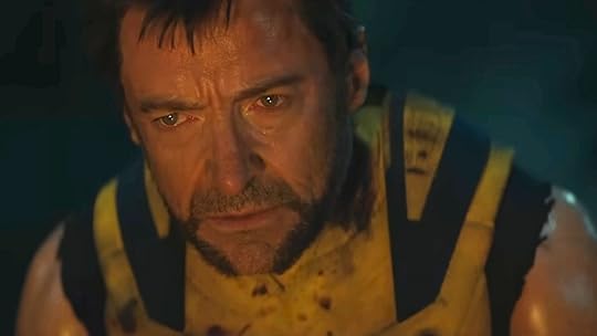 A sad Logan sits by a campfire in Deadpool & Wolverine.
