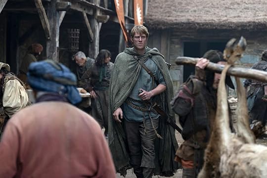 Ser Duncan the Tall in raggedy clothes walks through a market in A Knight of the Seven Kingdoms