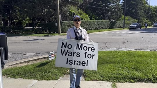 a man holding a sign reading 