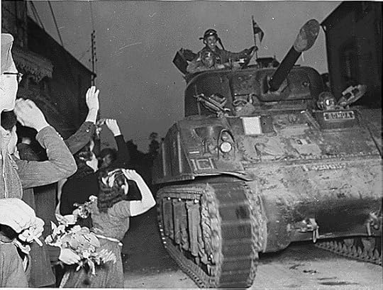 French civilians welcome US troops in Normandy, 14 August 1944. (US National Archives: ARC 196294)