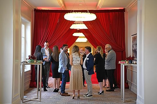 People mingle as they being to arrive during the Michelin...