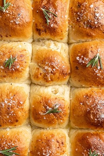 Closeup of white cheddar dinner rolls baked in a pan.