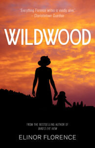 Wildwood, by Elinor Florence book cover, shows silhouette of woman and young child, both wearing hats, against a backdrop of orange sunset sky.