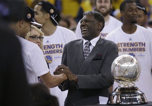 Golden State Warriors guard Stephen Curry, left, shakes hands with former coach Al Attles after Game 5 of the NBA basketball Western Conference finals against the Houston Rockets in Oakland, Calif., Wednesday, May 27, 2015. The Warriors won 104-90. (AP Photo/Ben Margot)